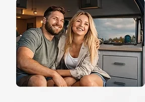 Happy couple inside the campervan
